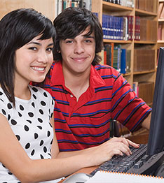 2 students on library computer